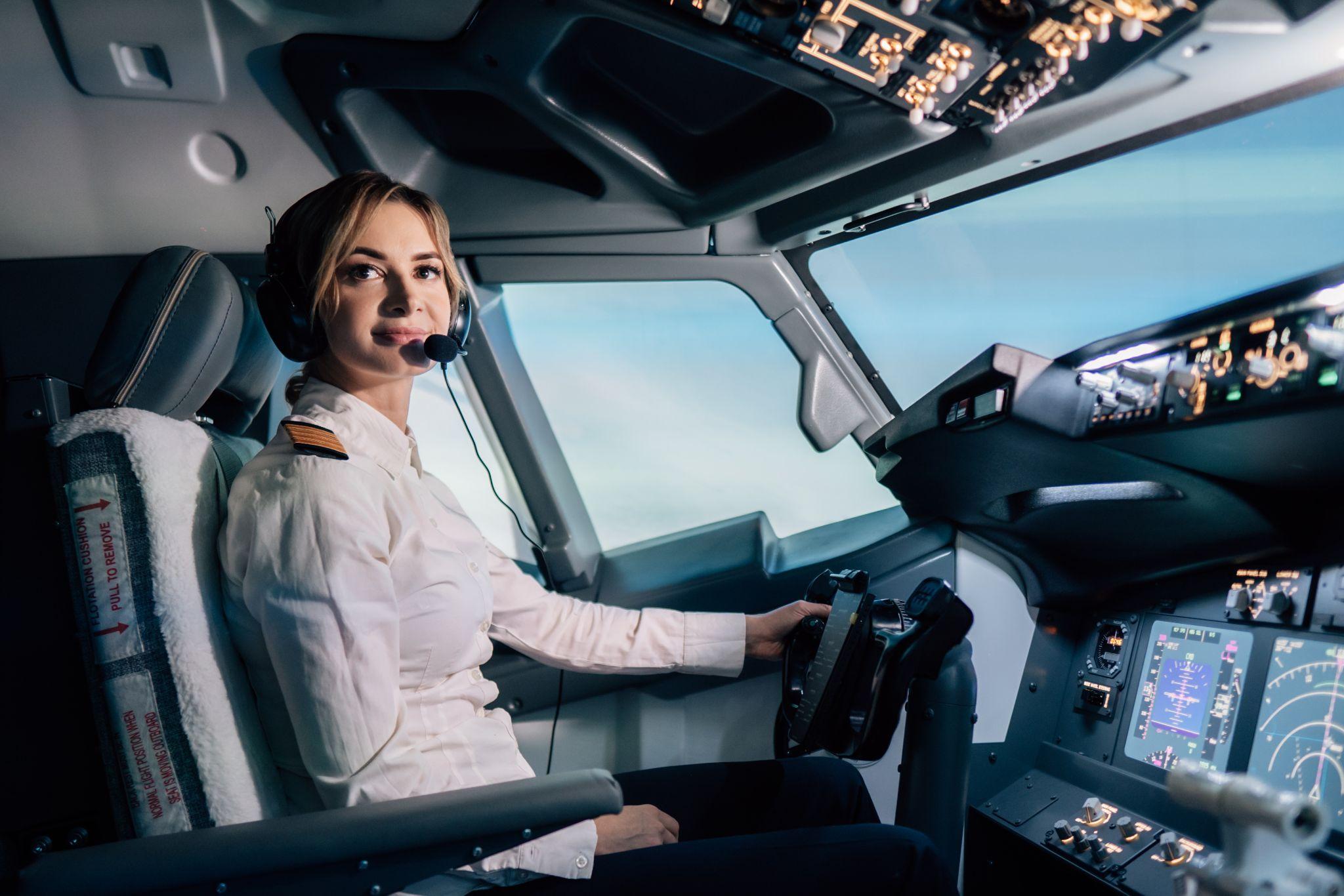 Woman pilot in the cockpit.